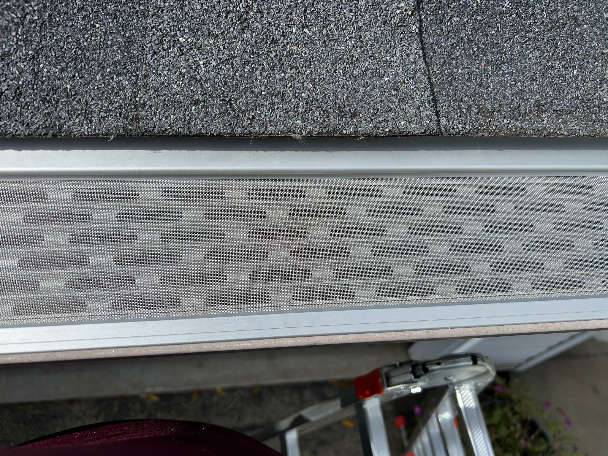 Close-up of micro-mesh gutter guard installation on a Lowcountry South Carolina home