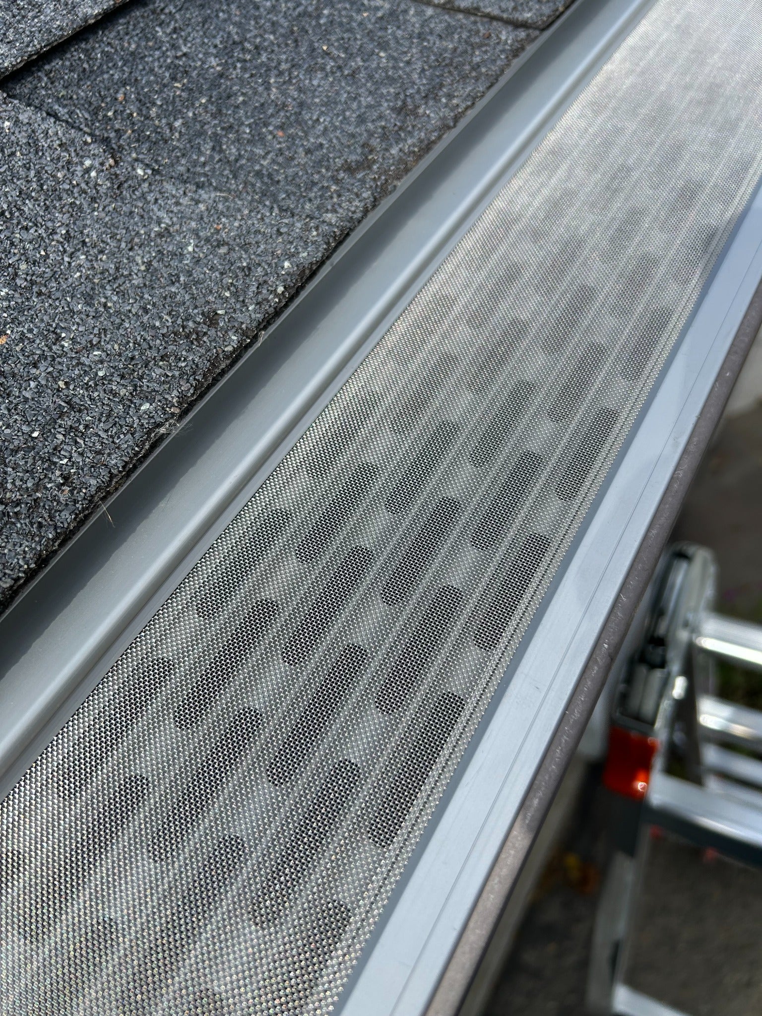 Detailed view of micro-mesh gutter protection installed along a Lowcountry South Carolina roofline